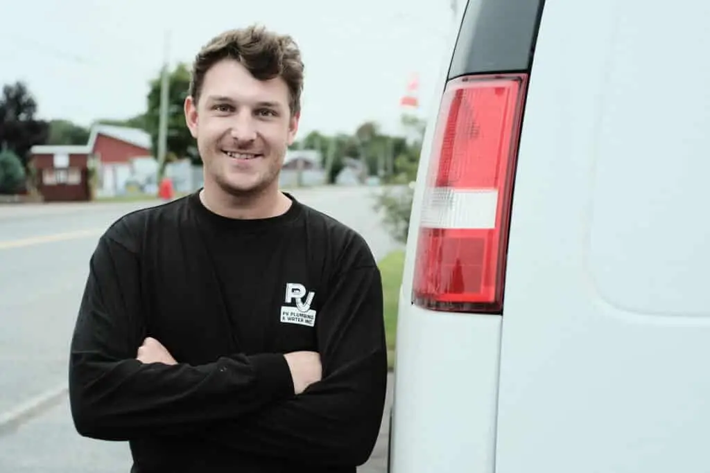 Well Technician standing next to service van.