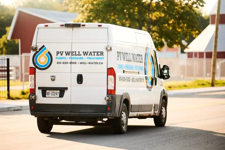 PV Well Water service vehicle driving through rural Ottawa.