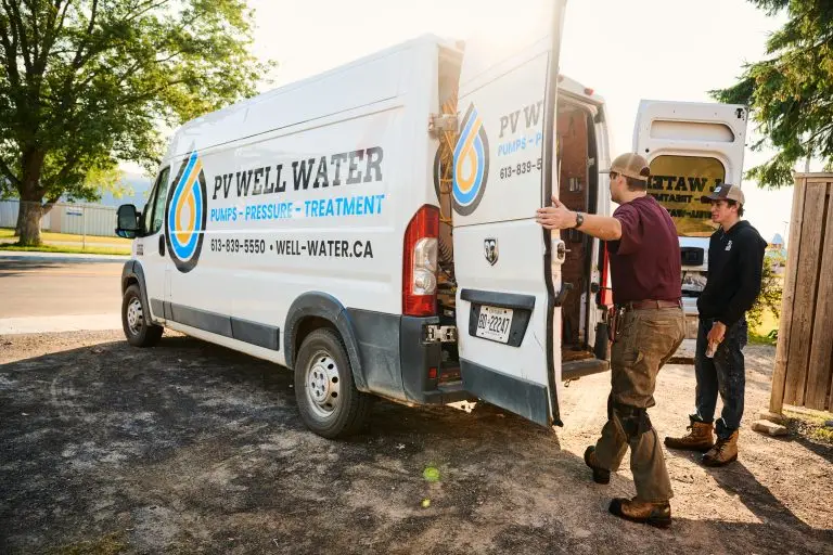 PV Well Water technicians loading a van.